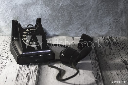 Picture of Vintage telephone on old wooden table